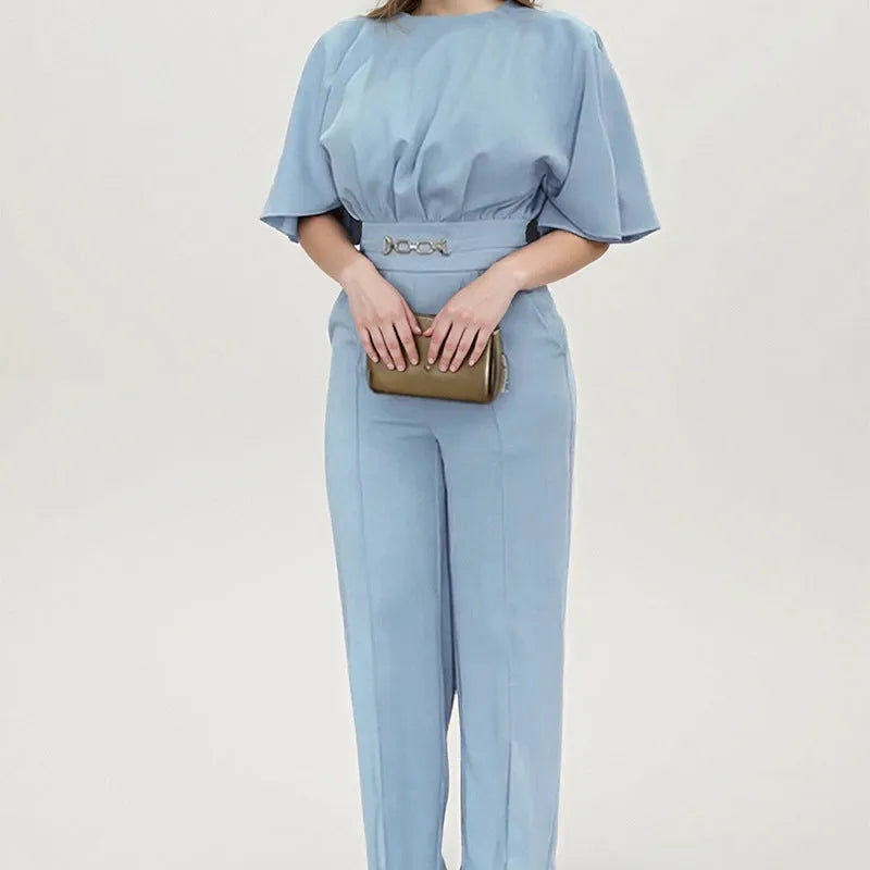Men's blue slim-fit polyester suit with trousers and long sleeves on a hanger