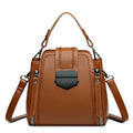 Small square vertical handbag in soft PU leather with textured stitching, shown in multiple colour options.