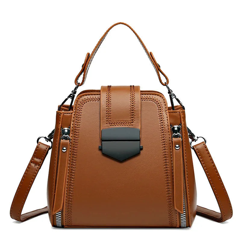 Small square vertical handbag in soft PU leather with textured stitching, shown in multiple colour options.