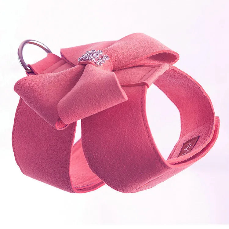 Pink microfiber dog chest strap with a bowknot, showing the harness design.