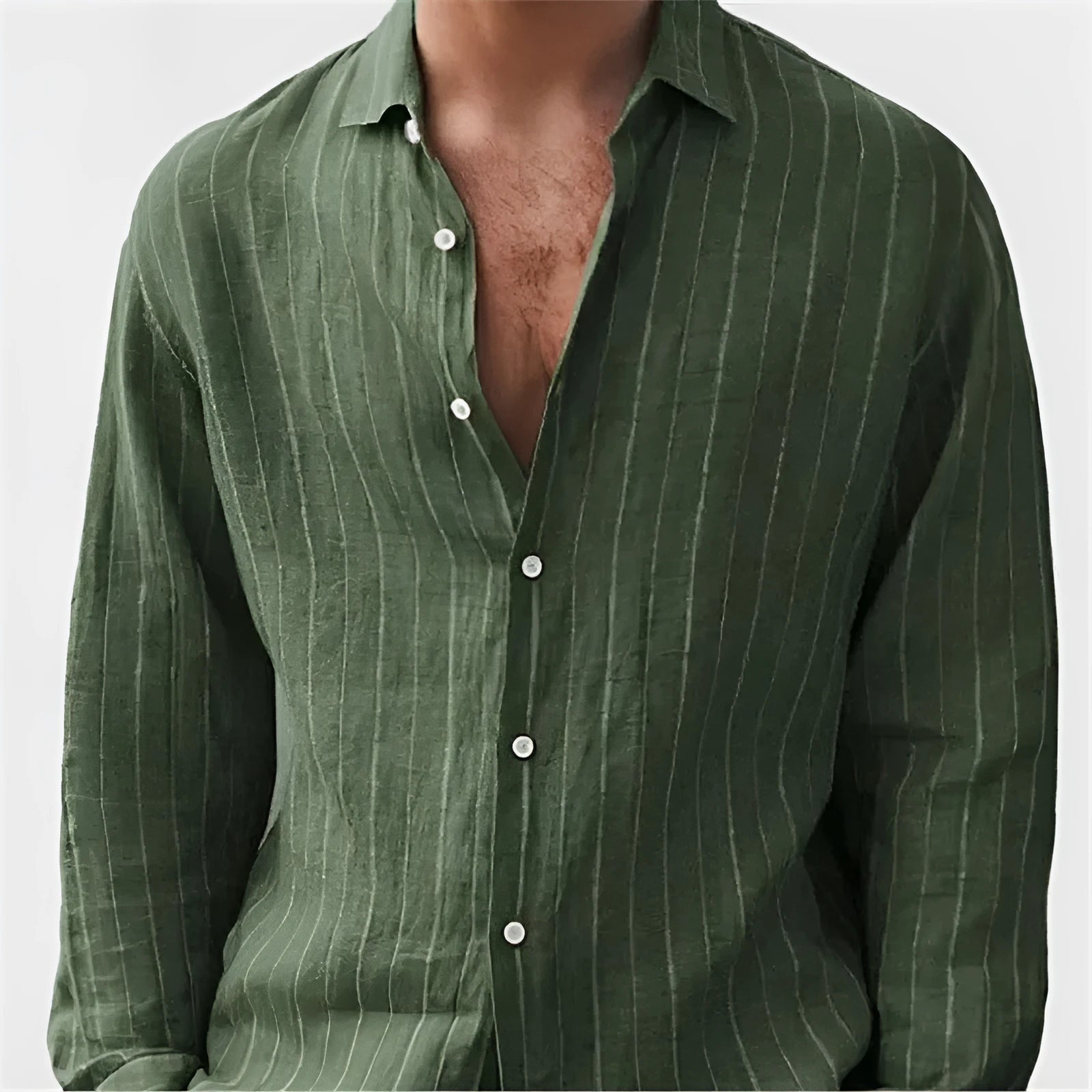 Man wearing a loose-fit, striped, short-sleeve cardigan shirt in a casual setting.
