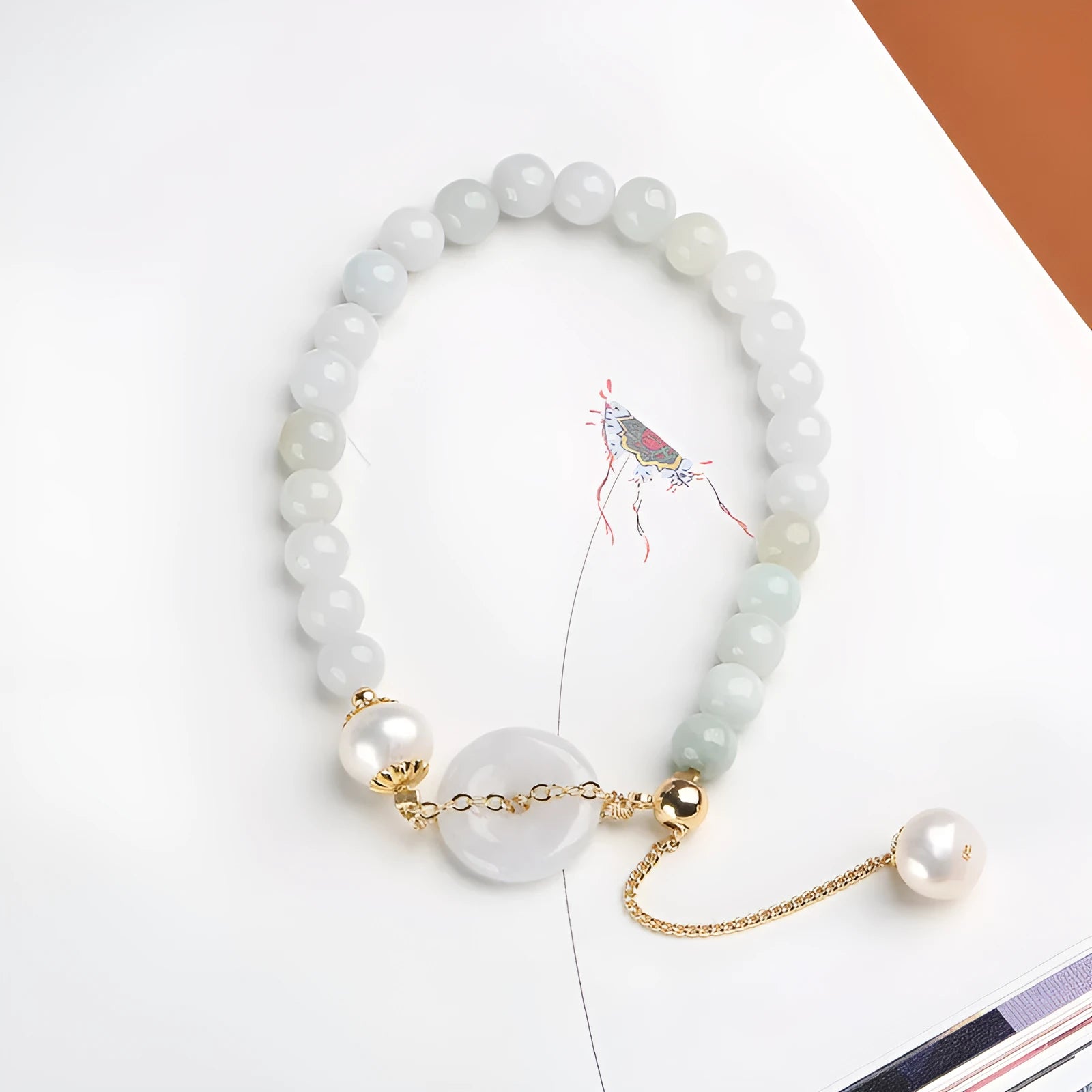 Handcrafted jade pearl bracelet with peace buckle closure in traditional Chinese style