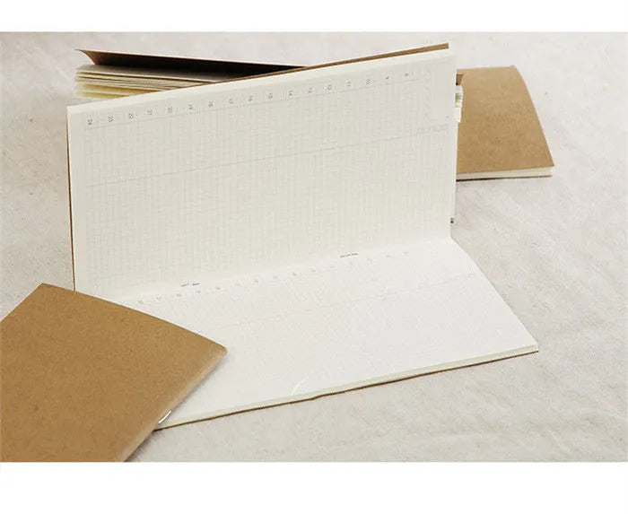 11x21cm cowhide diary refill notebook with saddle stitch binding and ivory white paper pages.