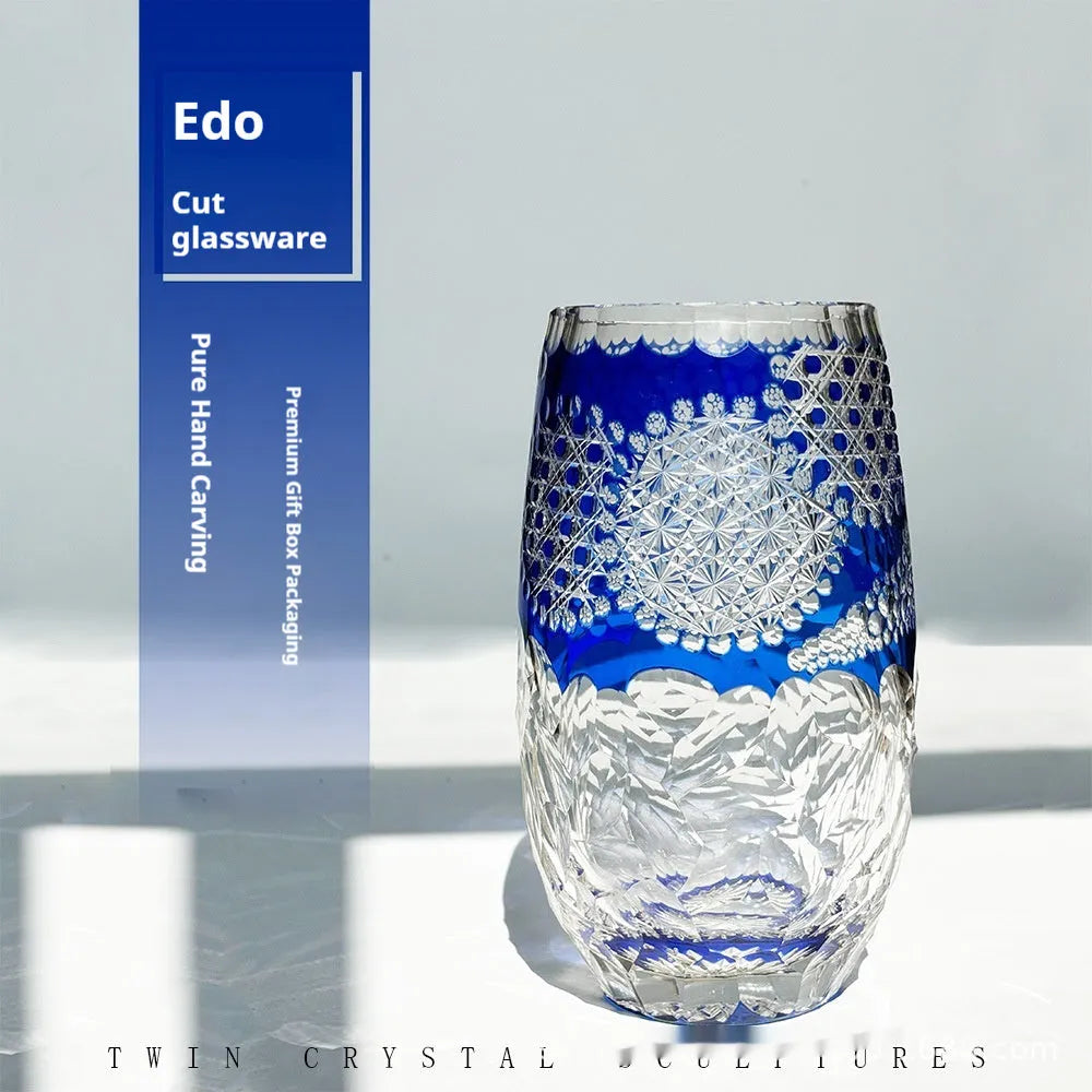 Blue Jianghu cut crystal glass tumbler 80x190mm on a wooden surface