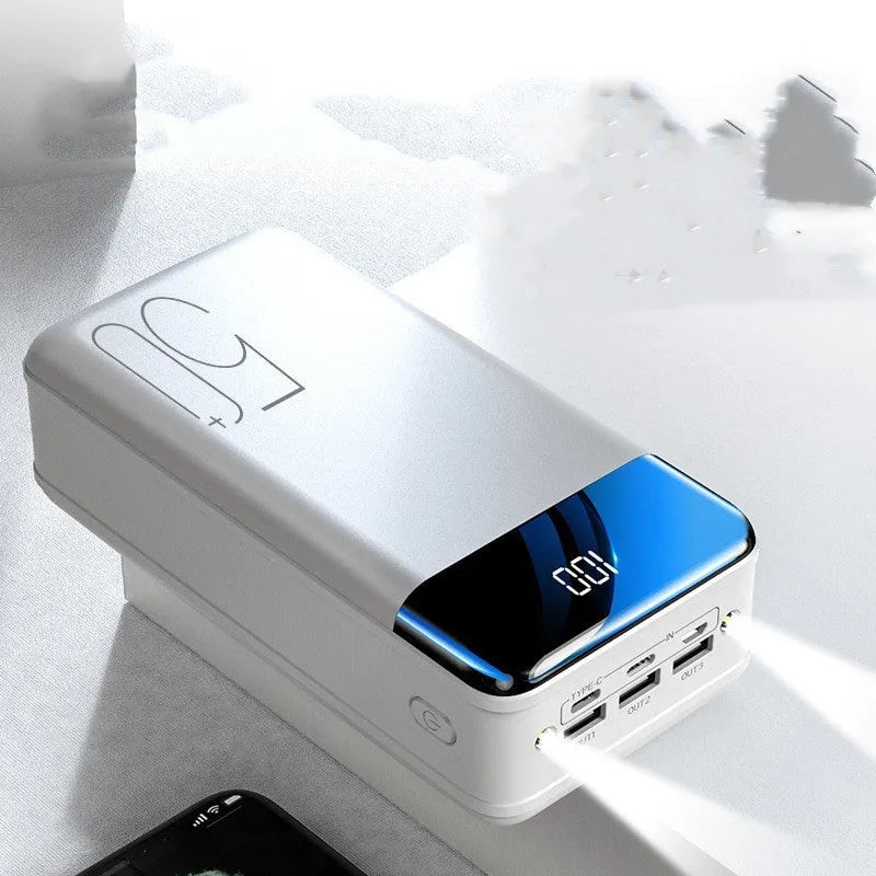 Large black or white 50000mAh power bank showing three USB output ports.