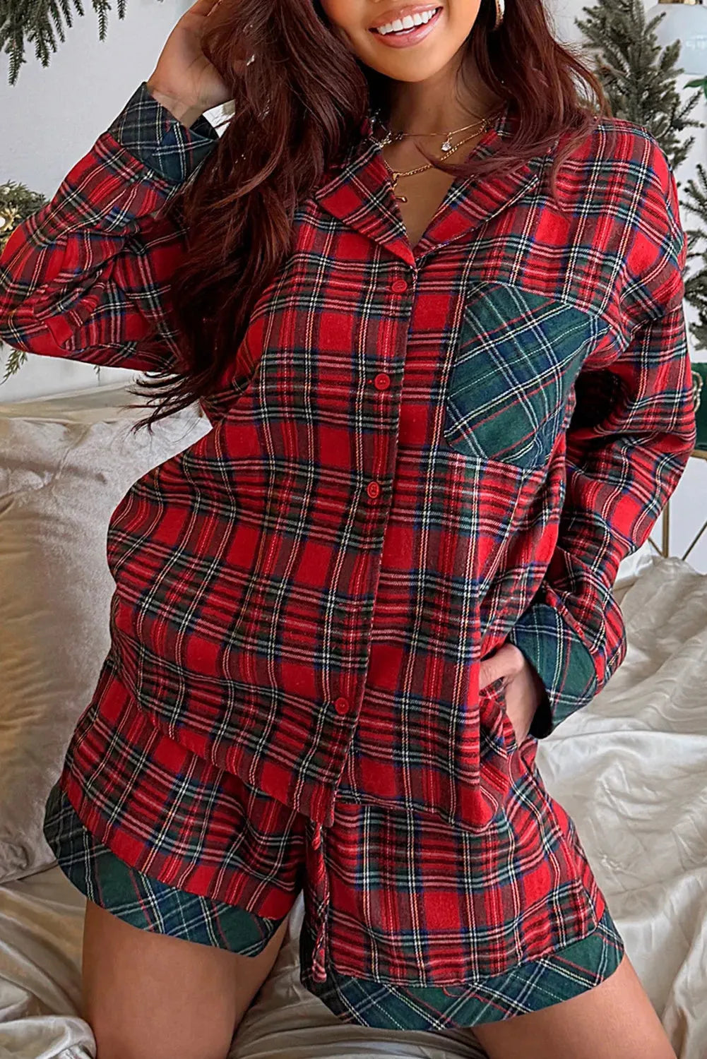 Red plaid Christmas pyjama set with long sleeve shirt and shorts.
