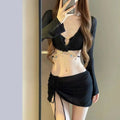 Women's black long sleeve bikini swimsuit made from polyester fabric for swimming.