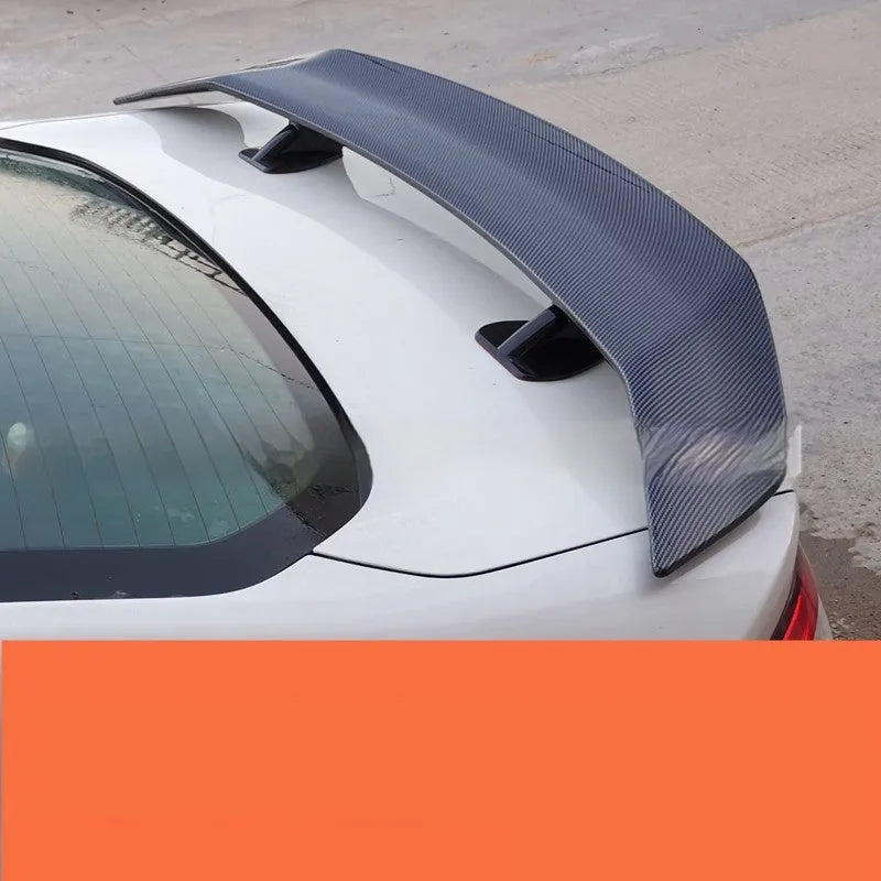 Universal punch-free car tail wing spoiler in ABS plastic, shown in a choice of finishes.
