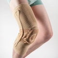 Adult sports kneecaps in black and blue colour, made from nylon and spandex material.