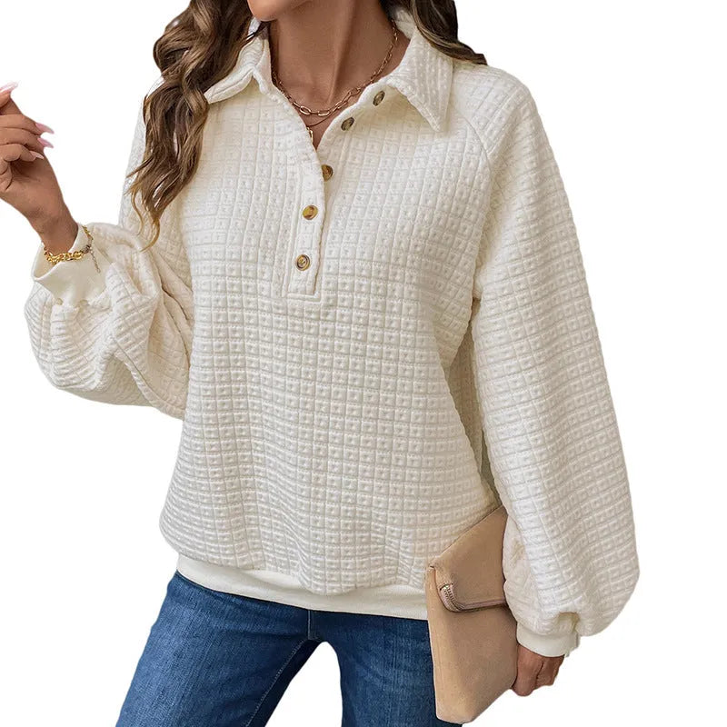 Women's beige thick polo collar long sleeve sweater laid flat.
