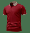 A green ice silk polo shirt with short sleeves and a flocked design on the front, laid flat.