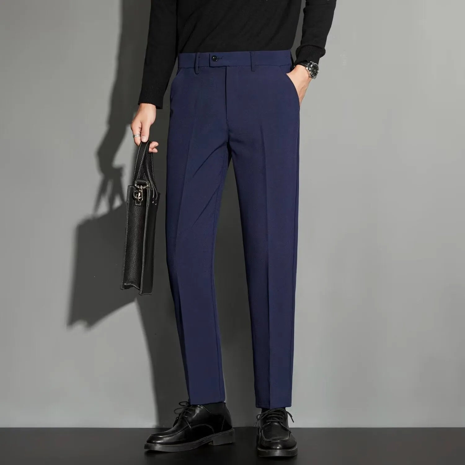 Men's straight cut ankle-length trousers in draping fabric showing apricot colour option