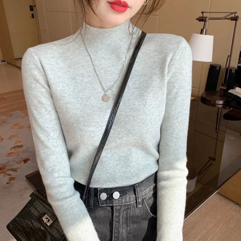 Slim fit long sleeve viscose top in apricot colour on a hanger