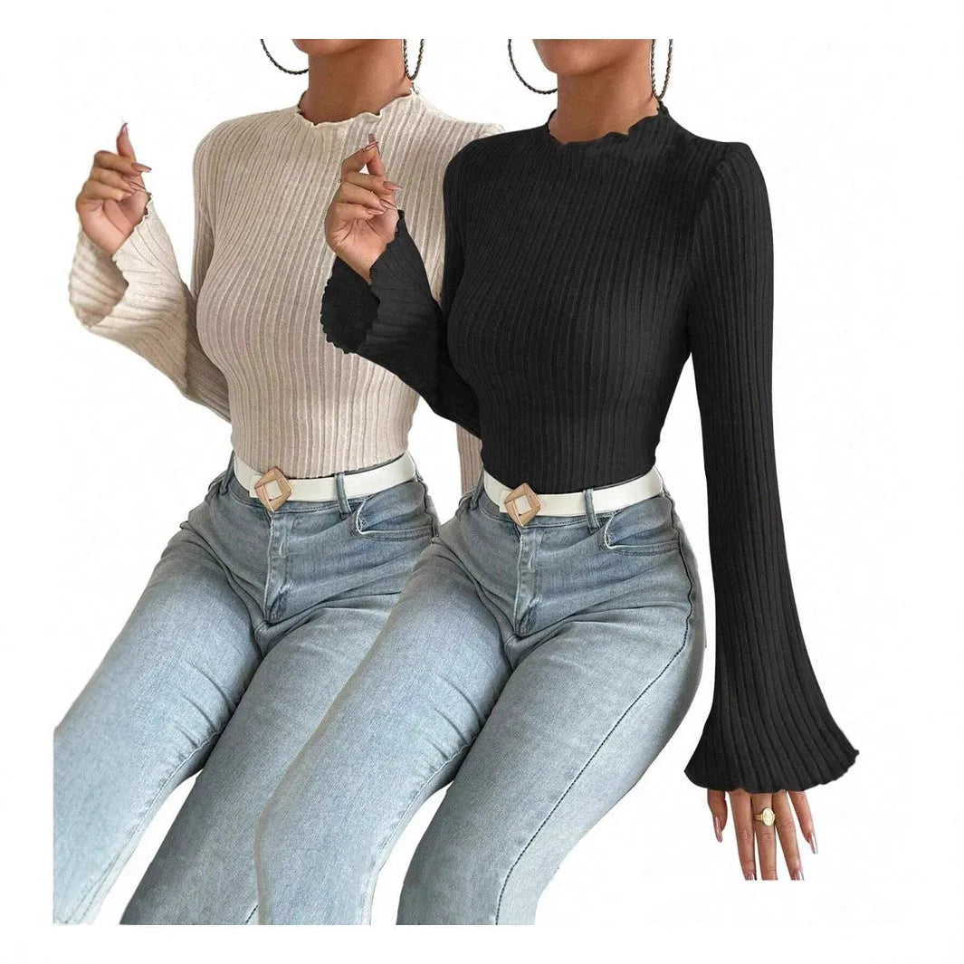 Black slim-fit long sleeve top with round neck and subtle sunken stripe pattern on soft brushed fabric.