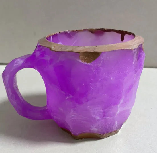 400ml resin mineral crystal coffee mug with handle, 10cm high, purple colour, on a table