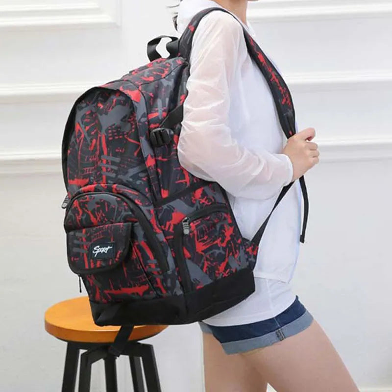 Classic blue nylon backpack with large main compartment shown open.