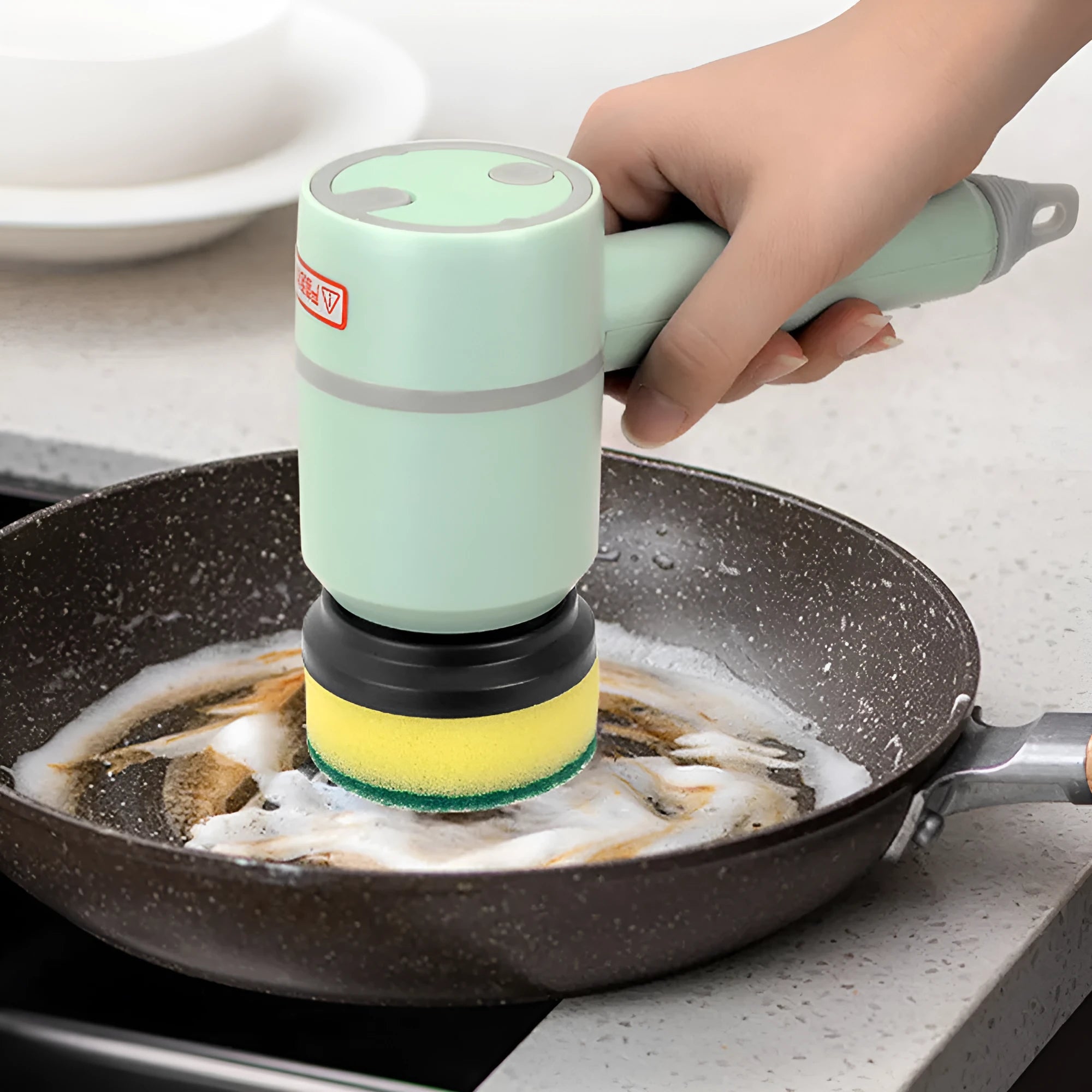 USB rechargeable electric cleaning brush with scouring pad, brush, and sponge heads in white.