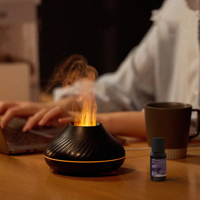 Beige USB aroma diffuser essential oil lamp with flame effect lighting on wooden surface