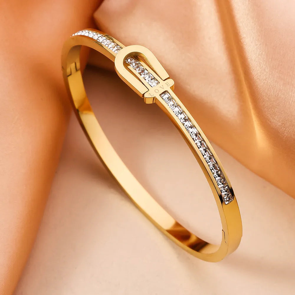 Gold plating titanium steel bracelet for women with electroplated finish, gold colour, on white background