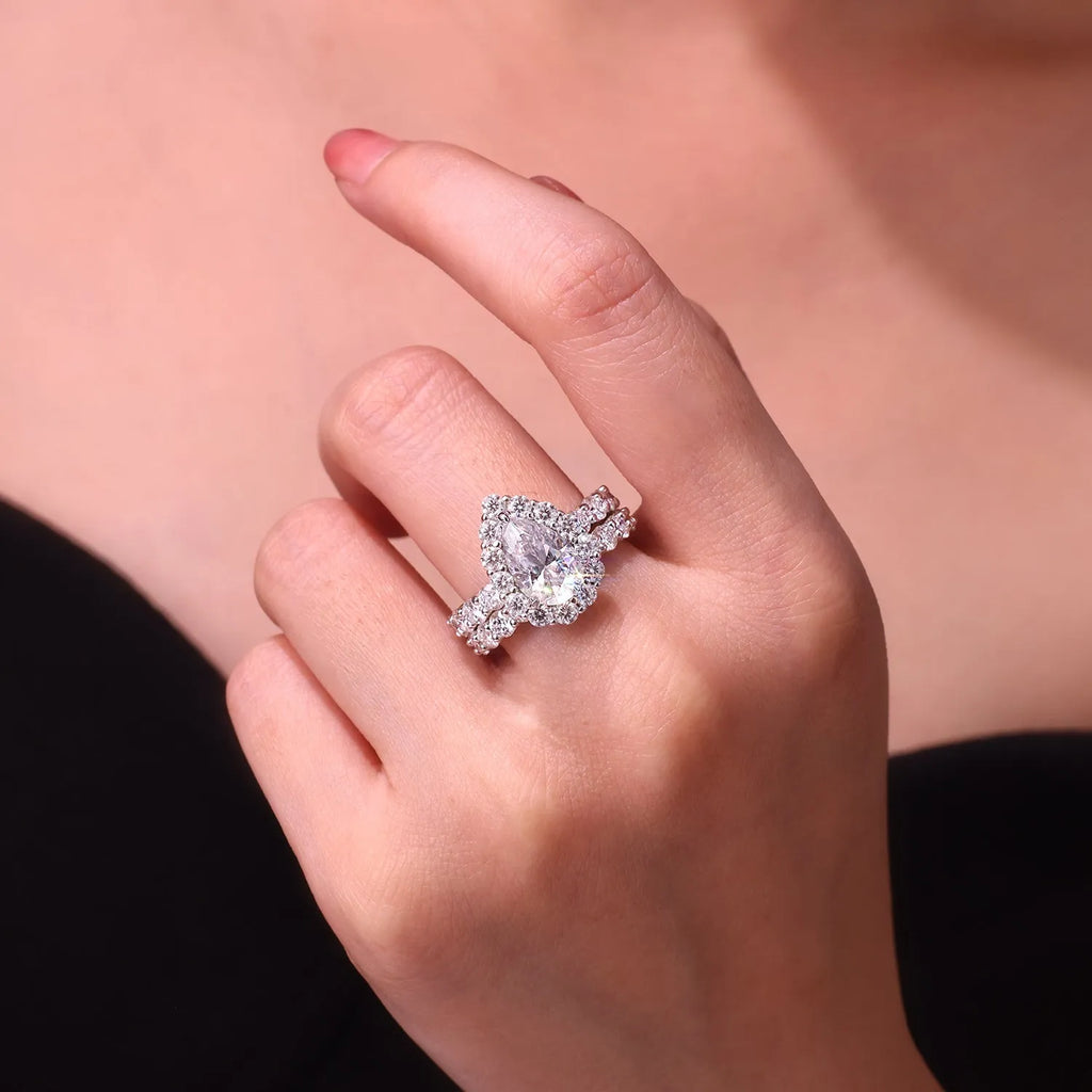Love ring with pear-shaped moissanite on S925 silver band platinum-plated finish sizes 5 to 9