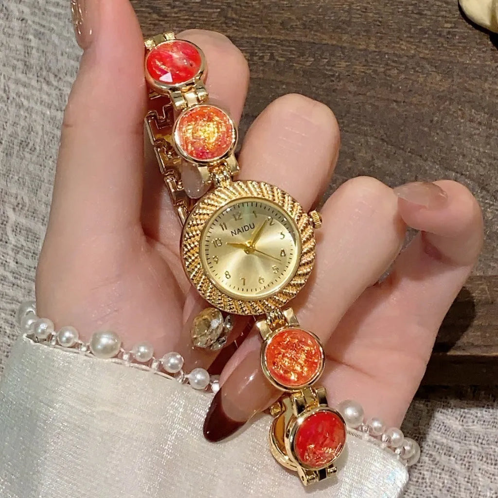 Women's round quartz watch with 25mm dial in zinc alloy case, showing colour options.