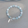 Glass crystal bead bracelet with blue moonlight colour and eight star design elements