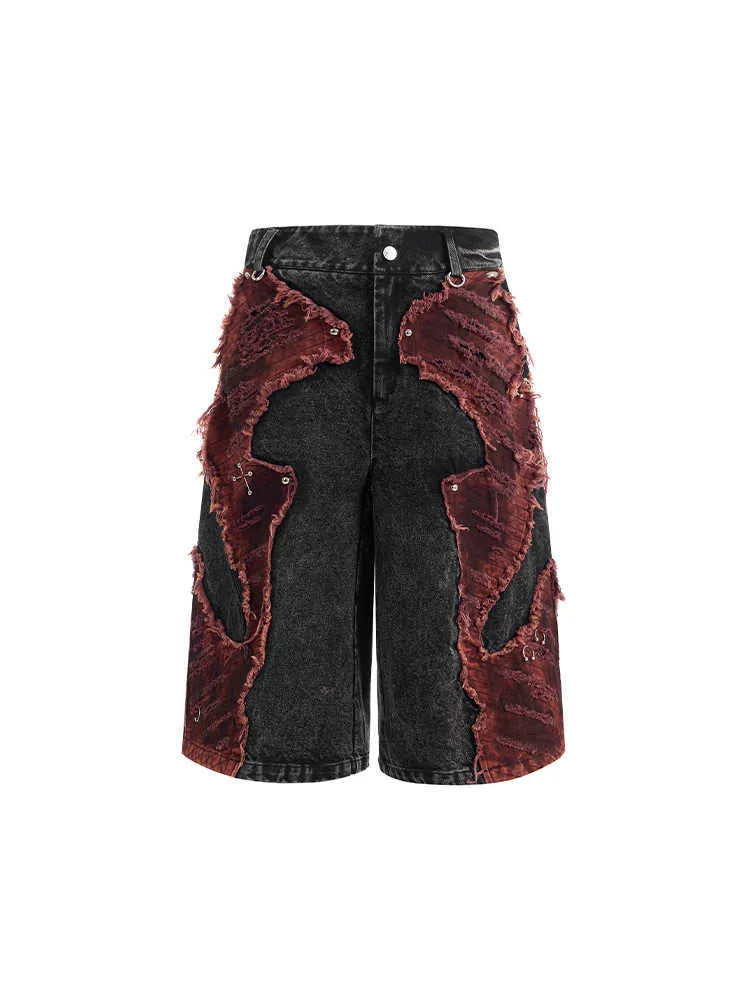 Distressed denim cropped pants with wide leg silhouette and brushed stitching details