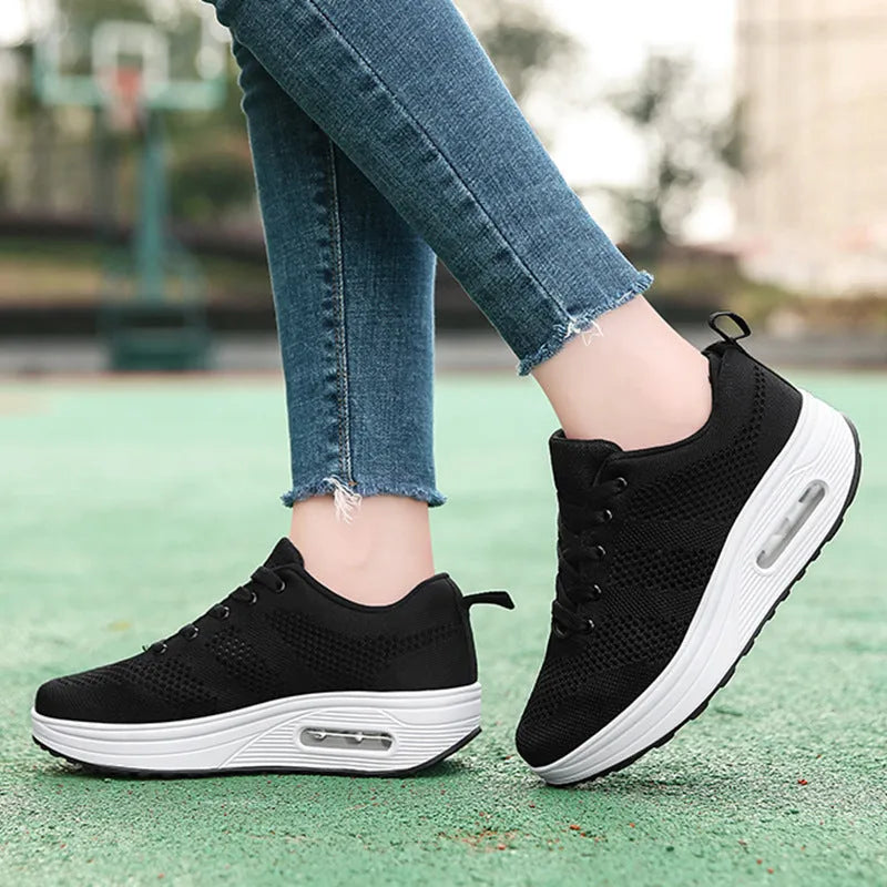 Women's solid colour flyknit platform casual shoes with a vulcanised air cushion sole and T-shaped ribbon.