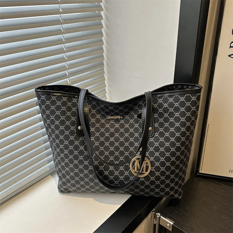 Western style textured PU shoulder bag in black, shown with contrast stitching and an adjustable strap.