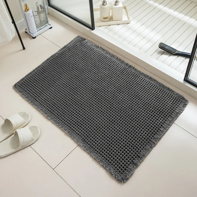 Checkered pattern non-slip absorbent bathroom floor carpet in beige colour.