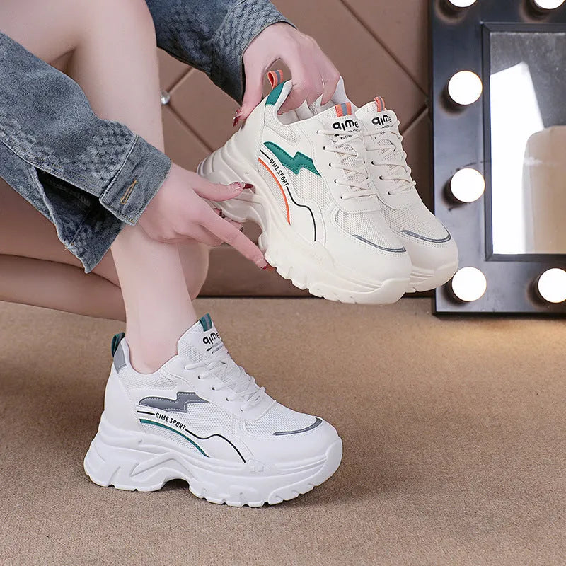 Women's white breathable dad shoes with lace-up front and cross shoulder strap on a rubber sole.