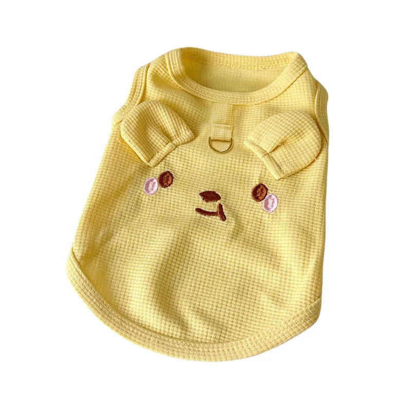Yellow waffle-knit vest for a small dog on a mannequin, showing casual pet clothing style.