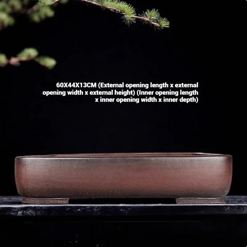 Handmade rectangular purple clay flower pot with antique finish showing internal planting space