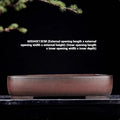 Handmade rectangular purple clay flower pot with antique finish showing internal planting space