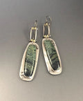 A pair of simple geometric drop earrings with a grey and white marble pattern on an alloy background.