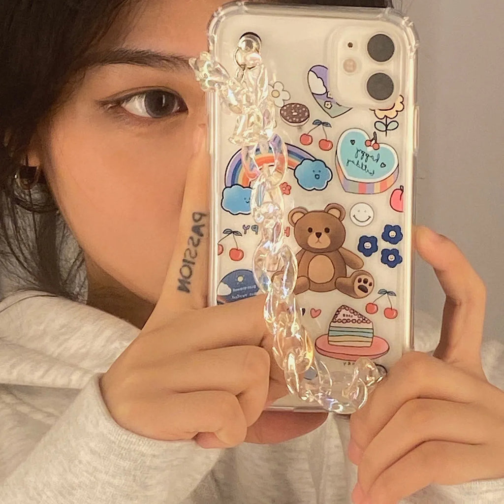 Clear TPU iPhone case with an attached bear chain and cartoon pendant charm