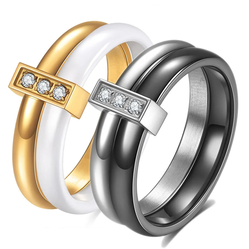 Geometric ceramic women's ring with zirconium inlay and glossy stitching in steel black.