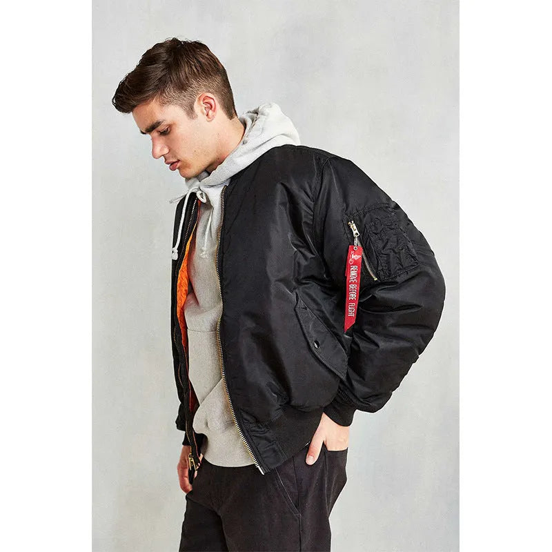 Men's army green loose fit cotton-padded pilot jacket with a double-sided construction on a hanger.