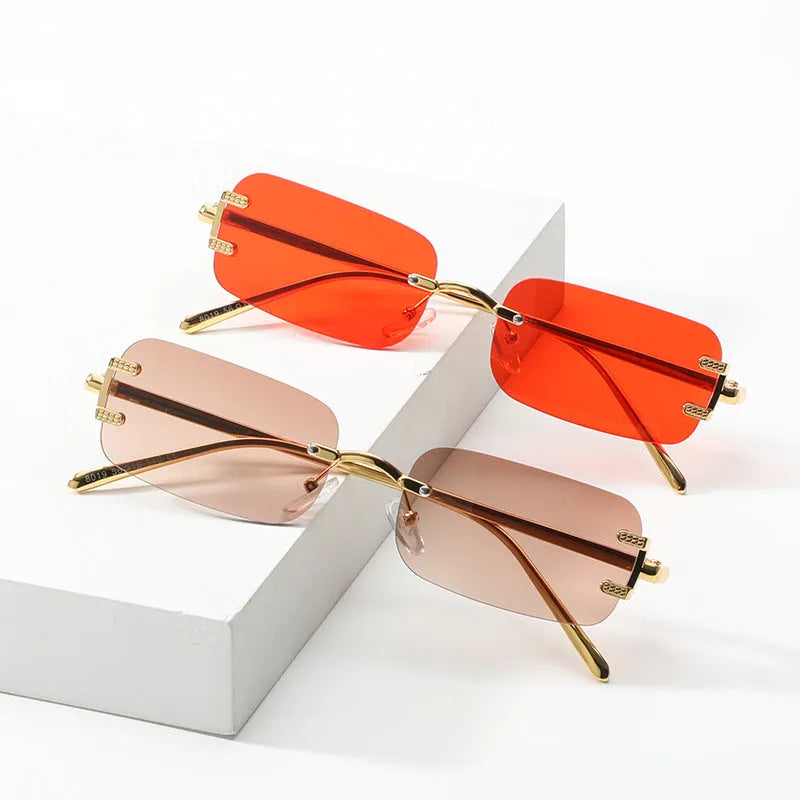 Retro square frameless sunglasses with metal frame and AC lenses, gold or black frame, six colour options.