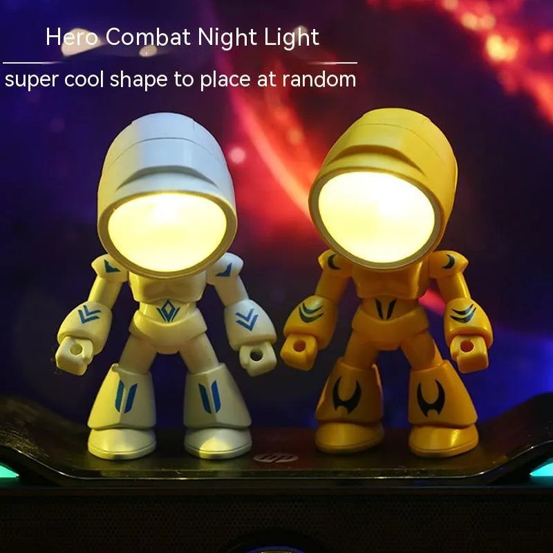 Mini LED hero robot night light with warm glow, adjustable arms, and 360-degree rotating head on a wooden shelf