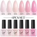 Set of twenty bottles of UV gel nail polish in solid and glitter colours for nail art.