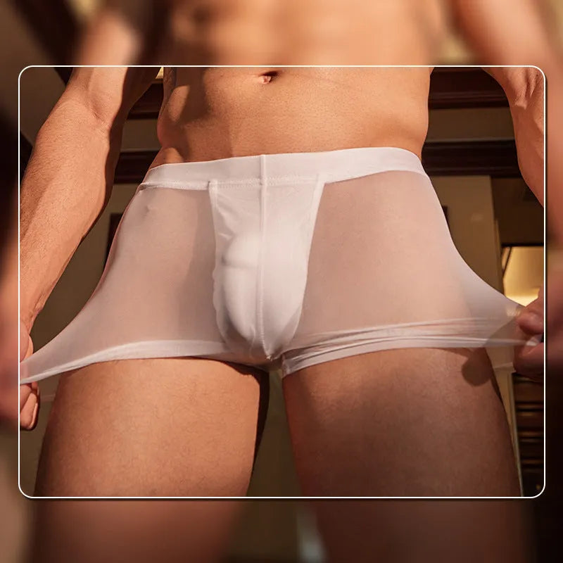 A pair of men's ultra-thin black boxer briefs made from breathable nylon fabric.
