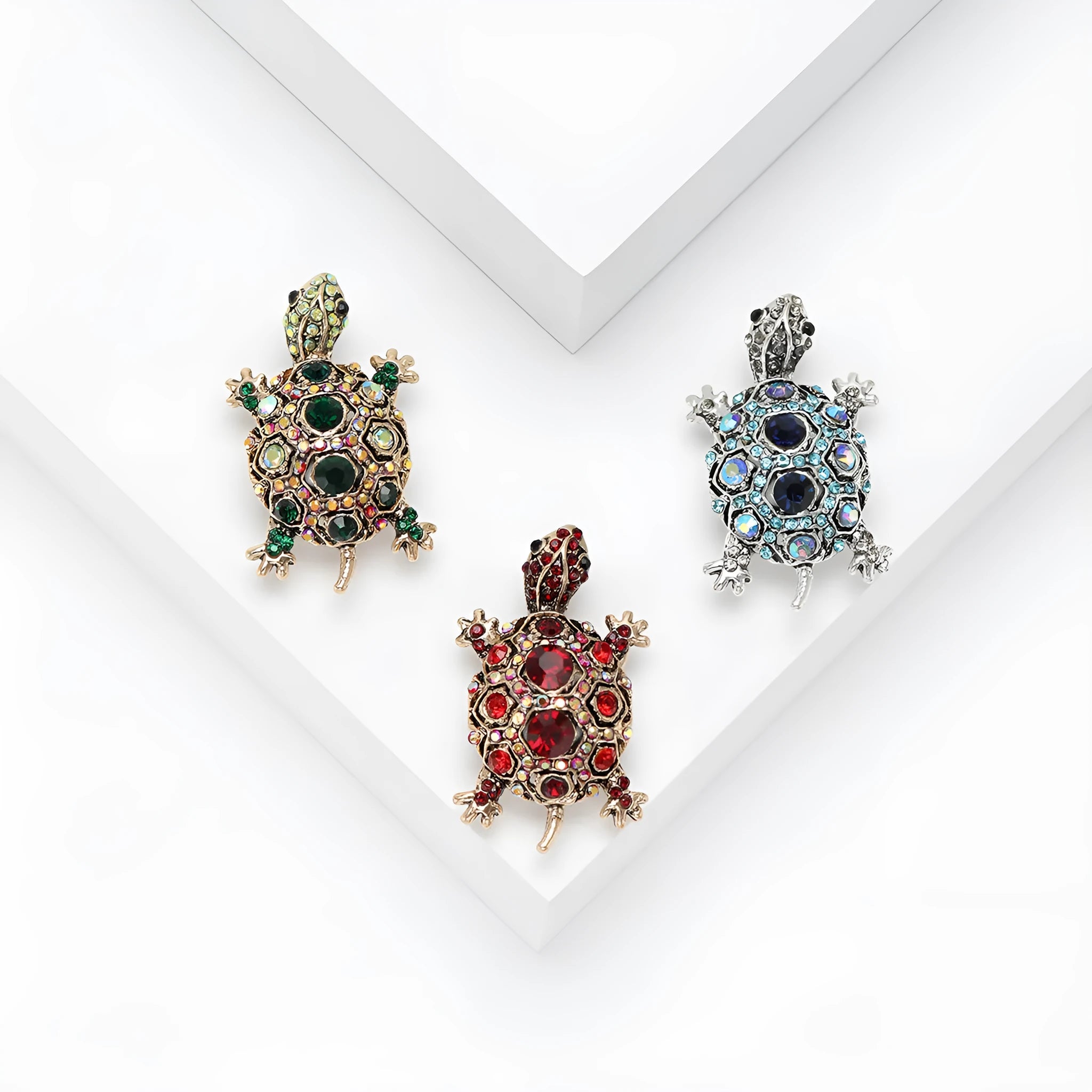 Retro-style alloy turtle brooch with rhinestone decoration, shown in blue colour.