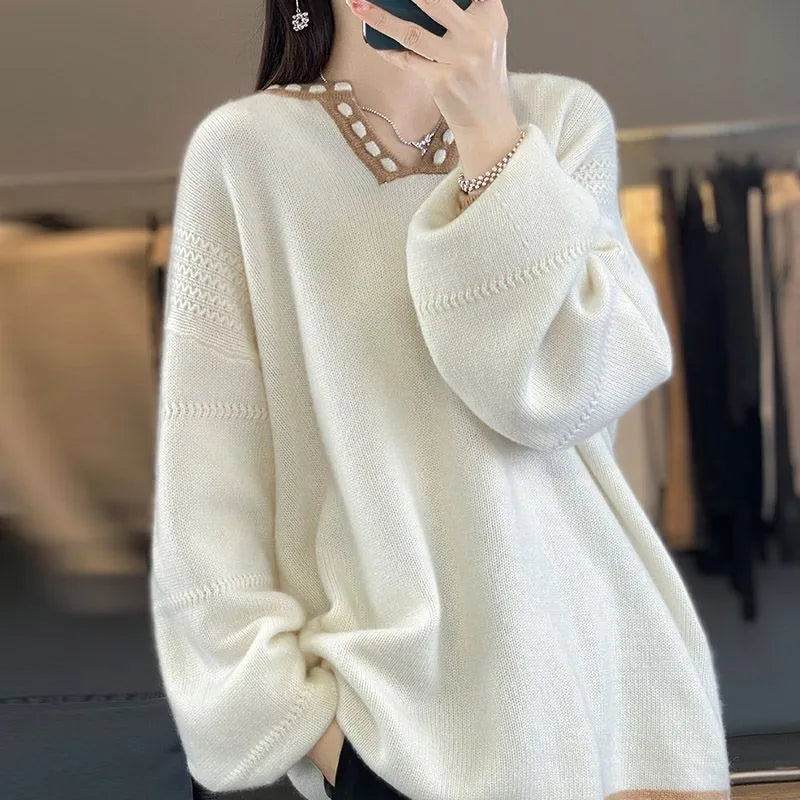 Women's camel coloured V-neck long sleeve viscose pullover sweater on a hanger.
