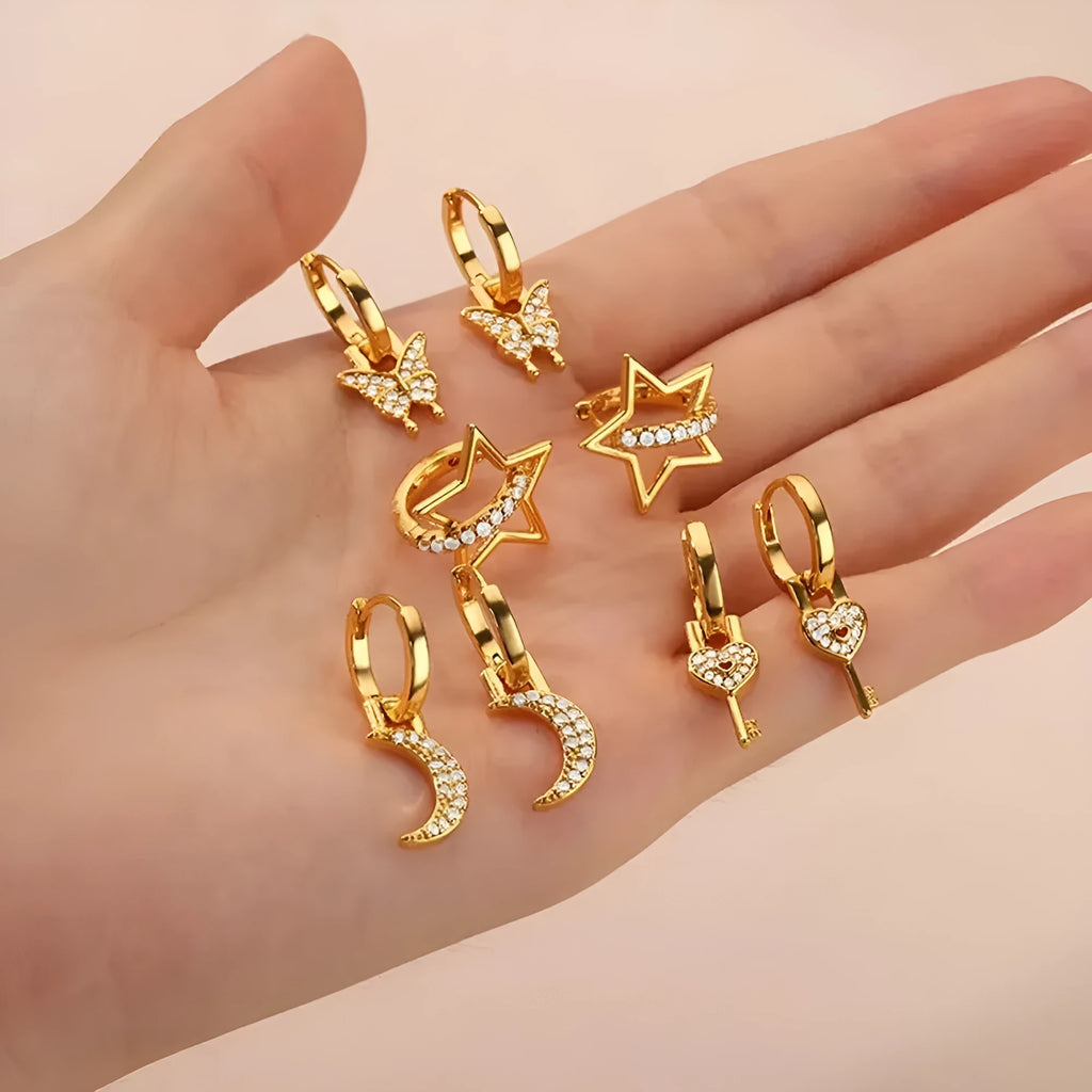 Women's geometric butterfly earrings in copper with heart and star details
