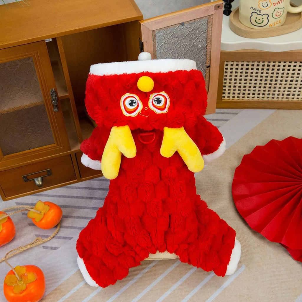 Red fluffy pet jacket with cartoon dragon design on a dog, showing velvet texture and fit.
