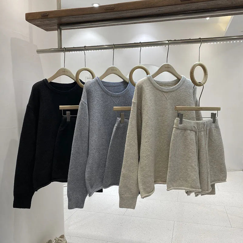 Women's knitted loose-fitting sweater and wide-leg shorts two-piece set in a neutral colour.