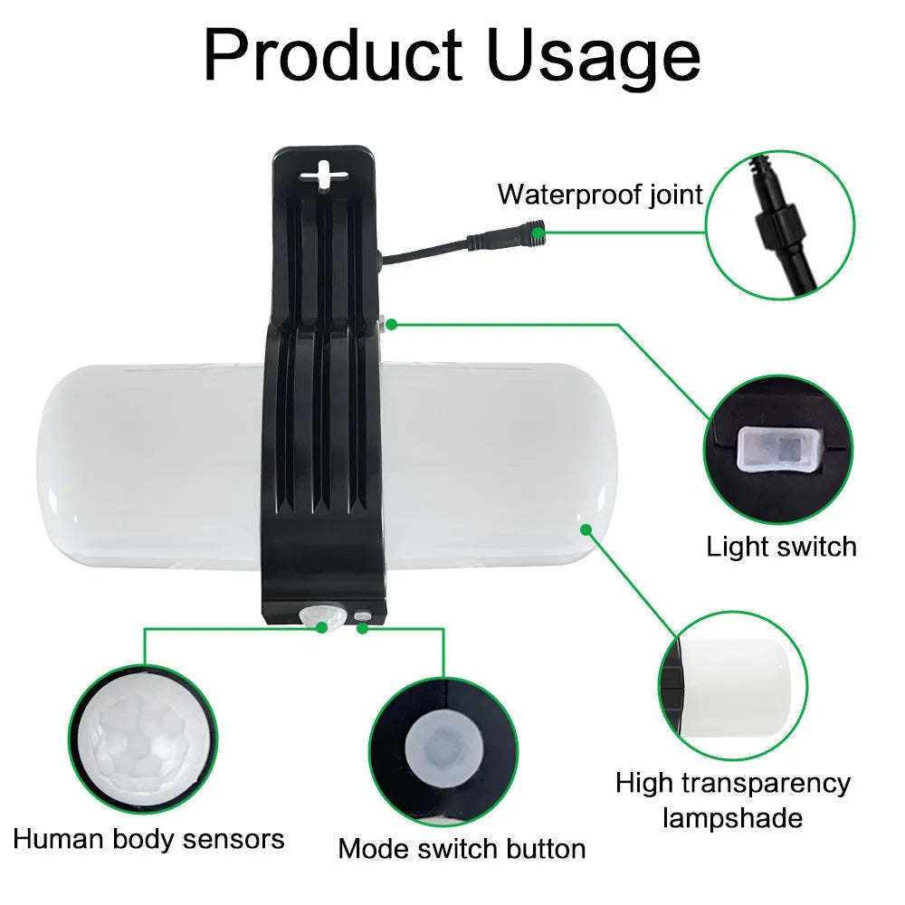 Black outdoor solar security floodlight with abstract design and mounting bracket on a wall.