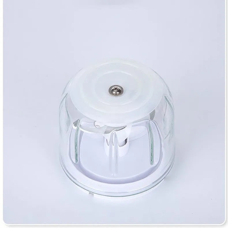 Household electric ice crusher in cherry blossom powder colour on countertop, 200W, 105x105x205mm