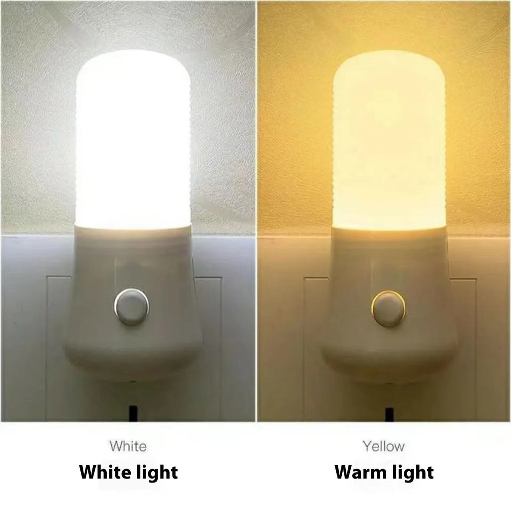 Minimalist white plug-in bedside night light with compact dimensions installed in wall socket